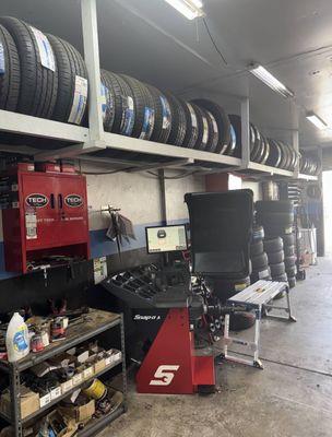 An image showcasing a diverse collection of automotive tires mounted on display racks