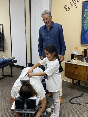 Teaching a future chiropractor how to massage after an adjustment