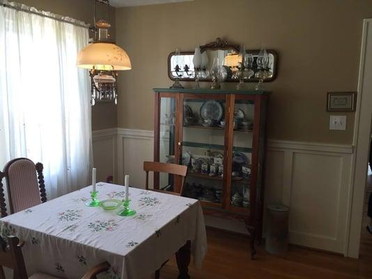 Private dining room full of antiques and family heirlooms