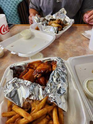 Sweet heat peach wings in the front; white buffalo dry wings in the back.