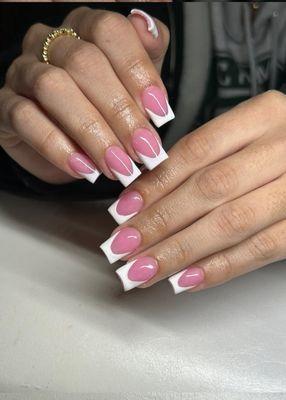 Clean, crisp, and effortlessly classy Short white French tips that prove less is more. Timeless elegance at your fingertips.