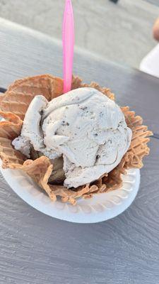 Oreo cookie scoop with a scoop of coffee ice cream on the bottom