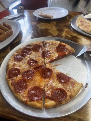 2 personal pizzza and cheese sticks was good but had to wait 15 mins to get some juice due to no good English workers on site