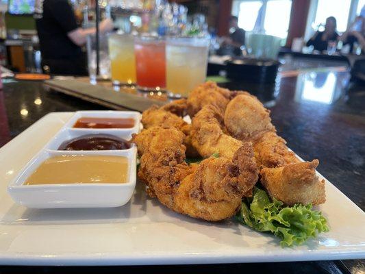 Chicken Tenders with Triple Dipping Sauce. Hand-battered and hand-cut; all natural, no anti-biotics ever.