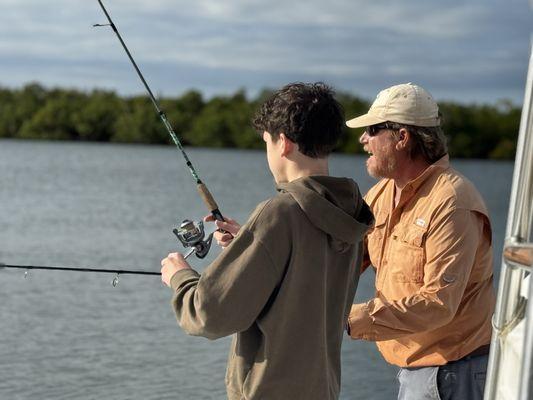 Capt Trent doing his thing teaching a kid to the SaltLife way