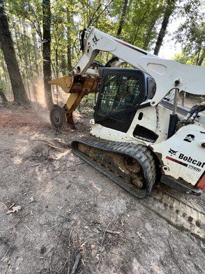 Skid steer stump grinding