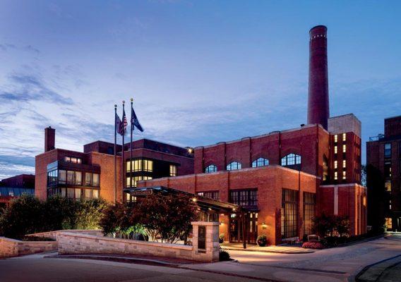 The iconic smokestack of our landmark building dominates the neighborhood skyline.