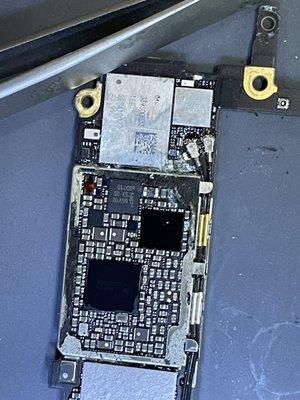 Corrosion on the back of the board due to liquid damage