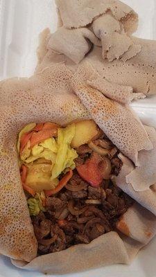 Awaze Tibs with local injera & cabbage and potatoes
