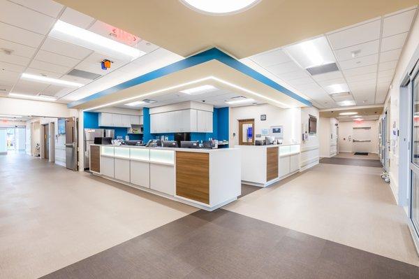 Nursing stations are designed to maximize sight lines and accessibility, allowing staff to easily monitor all exam rooms