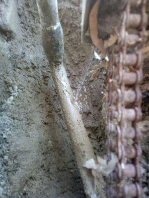 Below concrete ruptured pipe (multifamily apartment building.)