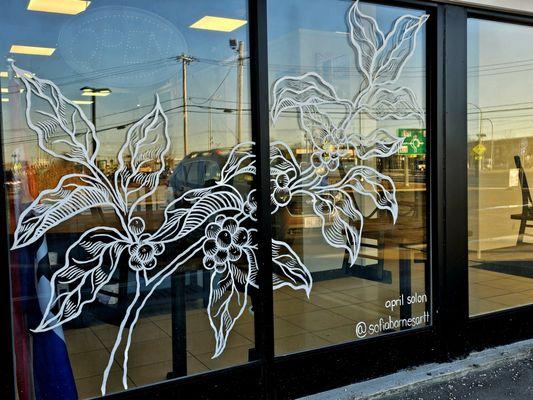 Window art by artist and barista Sofia Barnes.
