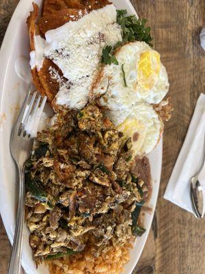 Chilaquiles with over hard eggs and machaca with scrambled eggs, beans and rice