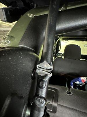 Brand new car, 2023 wrangler. Damaged discovered to Jeeps soft top bar after car wash.