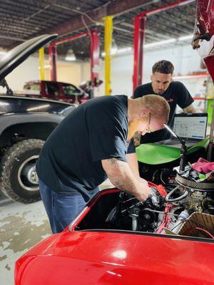 Auto Mechanic working on vehicle at Crew Co in Montgomery, Alabama
