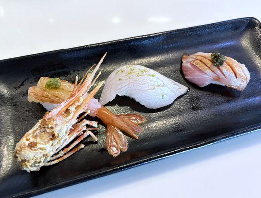 nigiri made with sweet shrimp, yellowtail belly and otoro