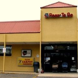 Street view of Floors To Go across from the water tower in historic Downtown Monroeville.