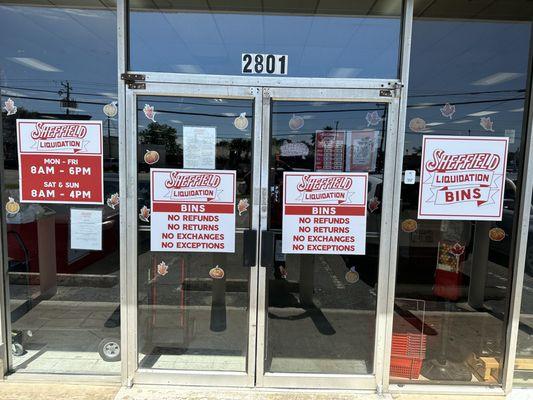 Signs on entrance to discount store