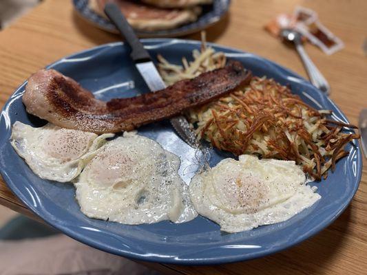 3 eggs over easy, hash browns and buffalo bacon