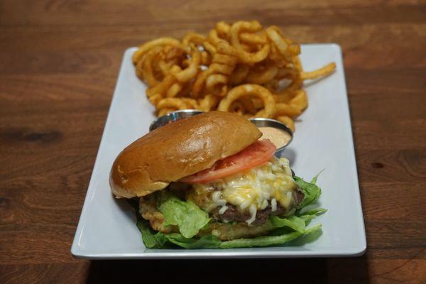 Chipotle sirloin burger with curly fries.