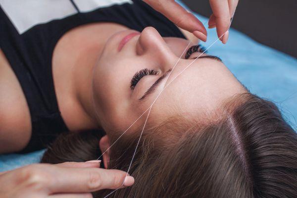 Eyebrows threading