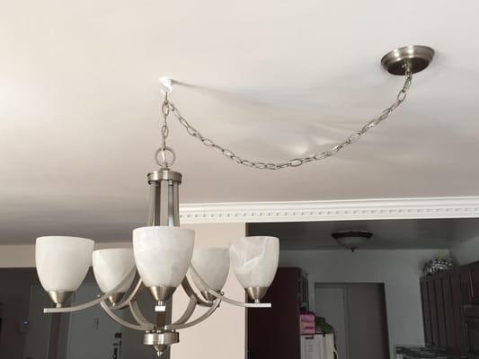An inexpensive way to relocate a hanging fixture to center your table.