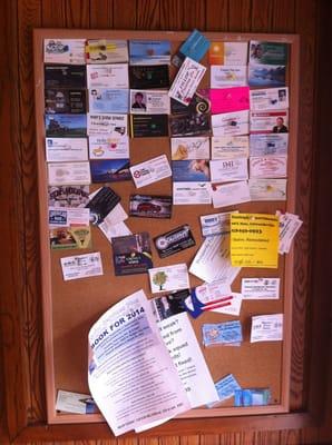 Community happenings board at entrance.