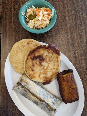 Combo plate 2 Papusas, a chicken Tamal, and a sweet milk Empanada with Cole slaw.