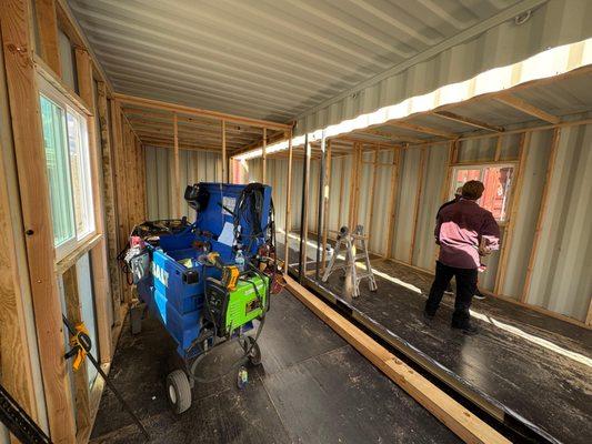 shipping container framing for custom office with windows and doors