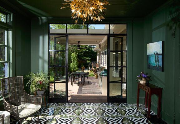 Compact backyard space with patio, multi-function pergola, grilling area, decks, lawn and water feature.