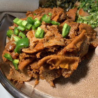 Yetsom Ferfer: Vegan Spicy Stew of Tomatoes, Berbere Sauce, Jalapeños, and pieces of Injera. This is fantastic! Our new favorite dish here!