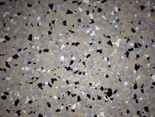 Factory 1 garage floor, close up of fully flaked epoxy flooring.