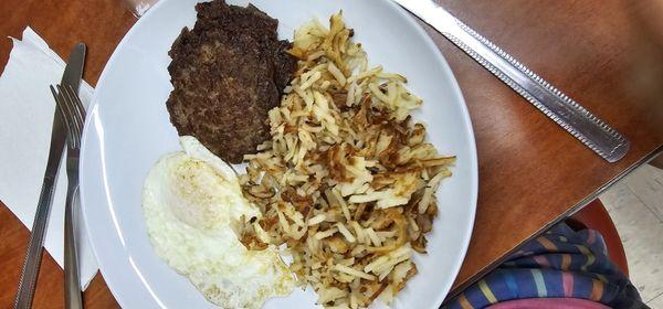 Sausage patties, over medium eggs and hashbrowns cooked to perfection.