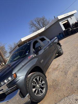 New tires in front of tire shop