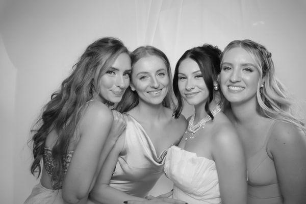 Elegant black and white wedding photo booth memories with the bridal party.