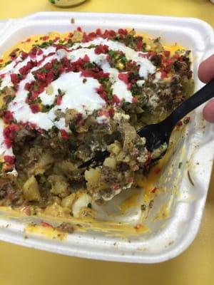 Potatoes with cheese, ground beef, onions, mushrooms, and sour cream