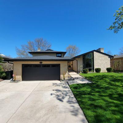 Lincolnwood home gets a full facelift--new roof, siding, windows, garage door, and gutters all covered by insurance after storm damage.