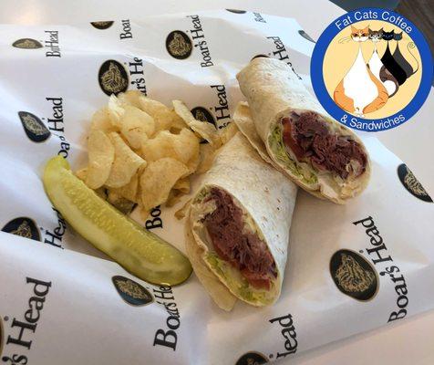 London Broil® Roast Beef featuring meat and cheese from Boar's Head. Served with chips and a pickle.