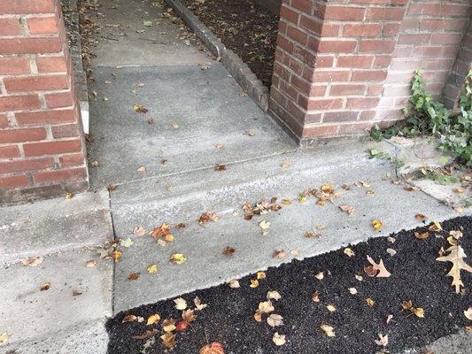 Repaired curb, gutter, and pillar footing