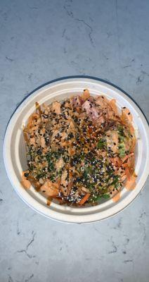 white rice, spicy salmon, spicy tuna, avocado, carrots, ginger, ponzu, spicy mayo, sushi sauce and sesame seeds