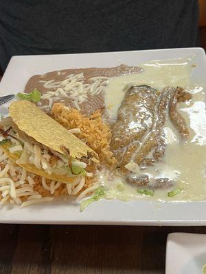 Combination with taco and relleno served with rice and beans