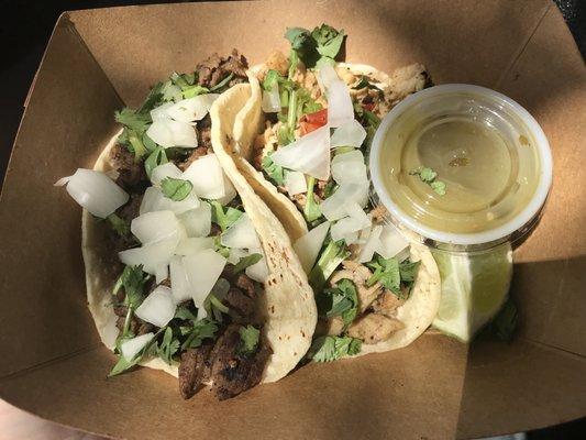Bistec & chicken tacos. He asked flour/corn, did I want onion/cilantro/salsa verde. Yes to everything! $3 each or cheaper 3pc combo w drink.