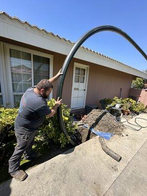 Trench-less sewer replacement, pulling a new pipe through the old broken sewer for a seamless replacement.