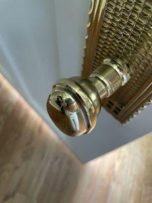 Brass finish is chipping from this interior door handle that isn't used frequently