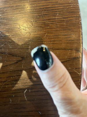 One of my nails that chipped, he did part black, and then designs on four nails all the black ones chipped
