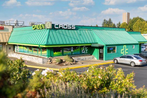 Exterior view of Green Cross on a sunny day.
