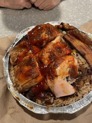 Jerk chicken with chicken gravy over the peas and rice and veg.