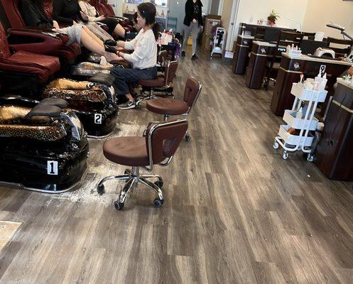Pedicure chairs and nail tables
