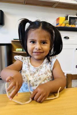 Stringing beads is a fun way to work on fine motor skills!