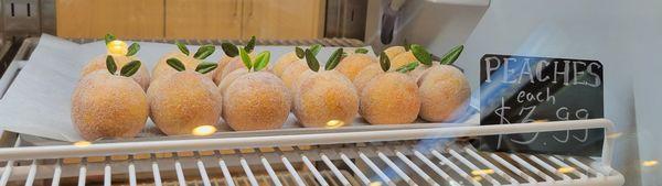 Called Piersici (Romanian for peaches) or Breskvice these peach shaped cookies are filled w/a cocoa-jam mix to resemble pit - made by owner